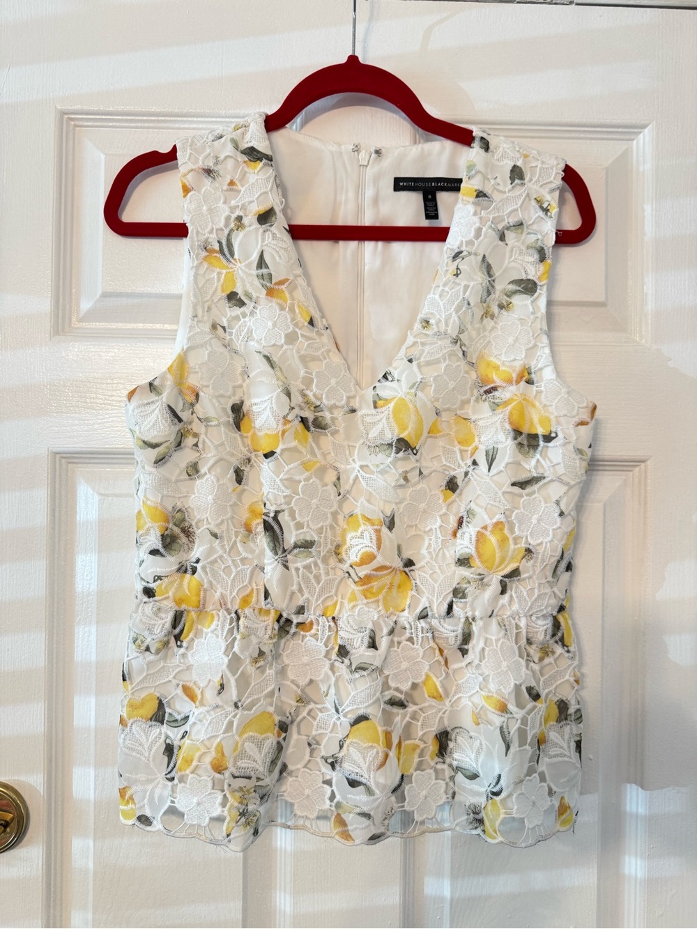 White House Black Market White Lace V‑Neck with Yellow Floral Appliqué